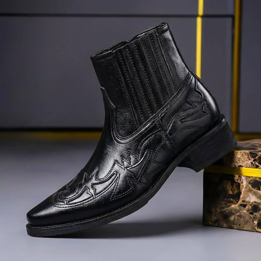 Obsidian black Western Chelsea boots with pointed toe and tooled overlay, side view